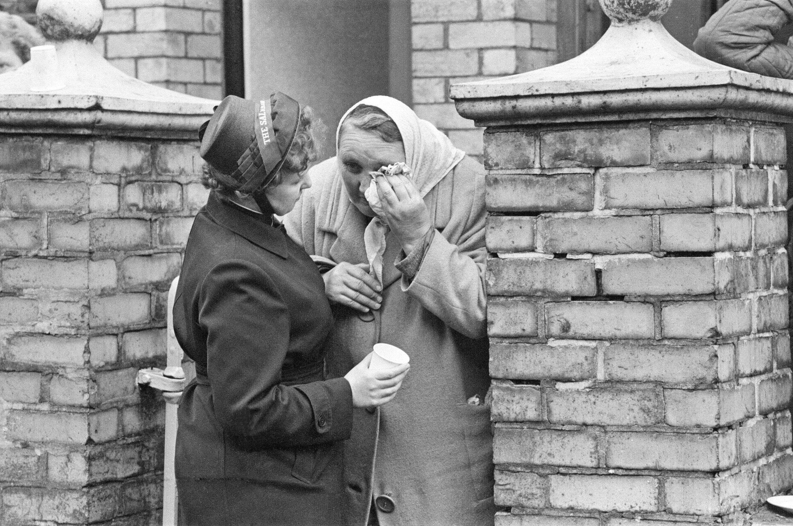 Aberfan - 21st October 1966A lady from The Salvation Army consoles an elderly lady who is distraught at the unfolding events in Aberfan today.The Aberfan disaster was a catastrophic collapse of a colliery spoil tip in the Welsh village of Aberfan, nea